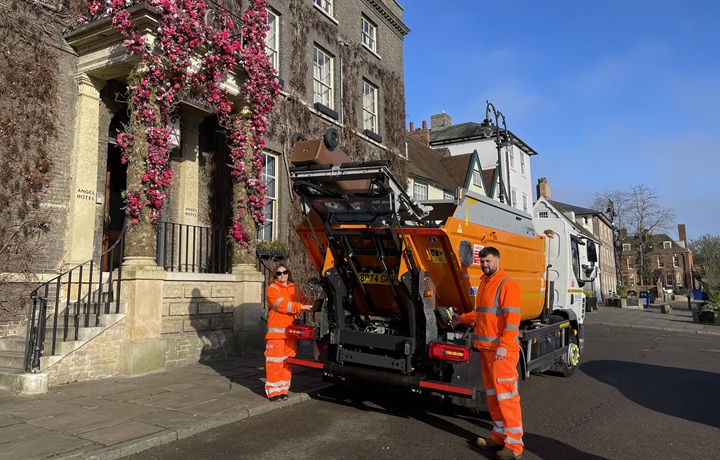 Waste operatives with new food waste collection vehicle Waste operatives with new food waste collection vehicle