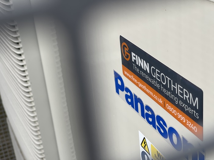 The image shows an air source heat pump installed by Finn Geotherm at a West Suffolk Council temporary accommodation site used to support people who are homeless The image shows an air source heat pump installed by Finn Geotherm at a West Suffolk Council temporary accommodation site used to support people who are homeless