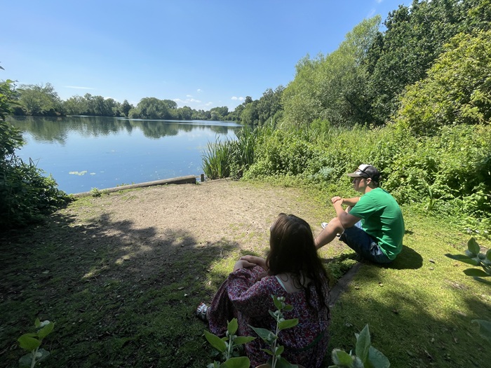 A mother and son look out over the lake at West Stow Country Park A mother and son look out over the lake at West Stow Country Park