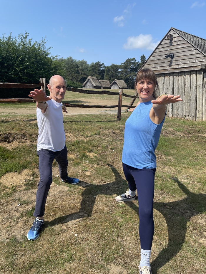 Robin Taylor and yoga instructor Tracey Clay perform warrior 2 pose Robin Taylor and yoga instructor Tracey Clay perform warrior 2 pose