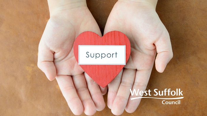 The word support is on a strapline across a red love heart being held by a pair of hands. West Suffolk Council's logo also features The word support is on a strapline across a red love heart being held by a pair of hands. West Suffolk Council's logo also features